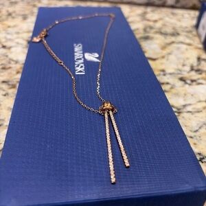 Swarovski knot pendant necklace in rose gold tone w/crystals. New with Box